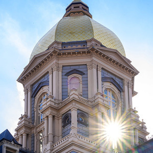 Image of the Golden Dome at Notre Dame with Sunburst